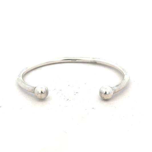 Silver torque bracelet with 20g weight, unbranded design, featuring a sleek, polished finish suitable for everyday wear.