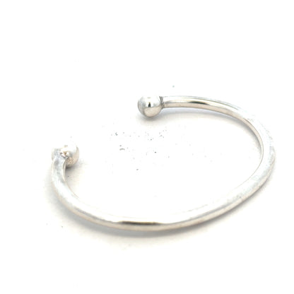 Silver torque bangle bracelet weighing 20g, unbranded, featuring a sleek, minimalist design with a smooth, polished finish.