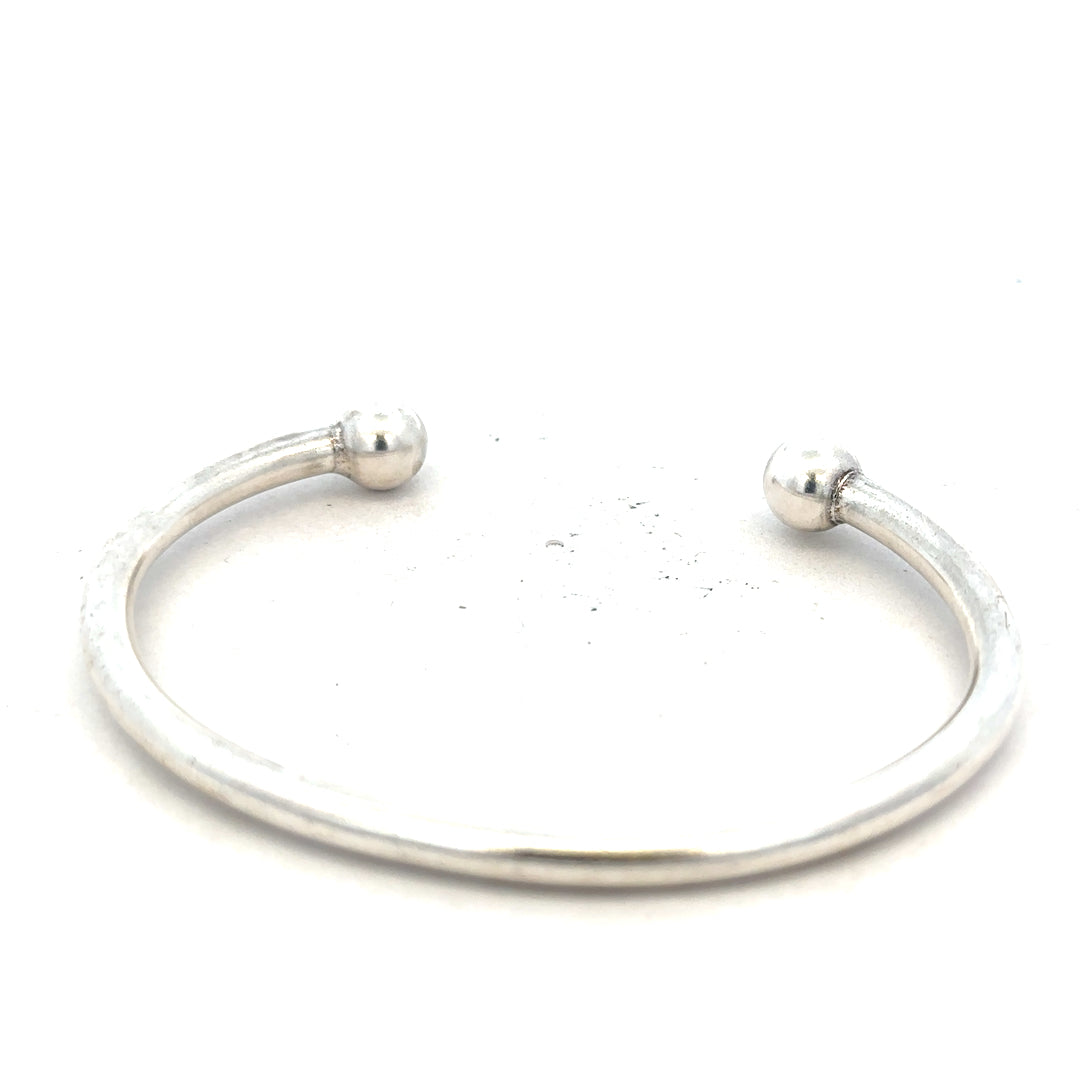Silver torque bracelet with a 20g weight, unbranded men's jewelry bangle showcasing a sleek, minimalist design.