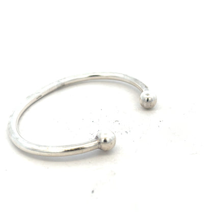 Silver torque bangle bracelet, 20g, unbranded, with a sleek, polished design shown on a neutral background.